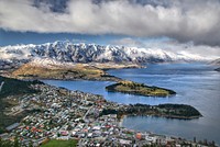 Queenstown. Lake Wakatipu. The town is built around an inlet called Queenstown Bay on Lake Wakatipu, a long, thin, Z-shaped lake formed by glacial processes, and has views of nearby mountains such as The Remarkables, Cecil Peak, Walter Peak and just above the town, Ben Lomond and Queenstown Hill. Original public domain image from Flickr