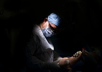Plastic surgeon prepares a patient for a skin graft procedure in one of the hospital&#39;s operating rooms. (U.S. Navy photo by Mass Communication Specialist Seaman Luke Cunningham). Original public domain image from <a href="https://www.flickr.com/photos/navymedicine/50862671258/" target="_blank">Flickr</a>