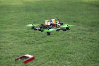 Midshipmen 1st Class Lenny Davis, president of the USNA Drone Racing Team, and Midshipmen 2nd Class Hyun Lee, vice president of the USNA Drone Racing Team, perform operational testing and record subsequent data on a racing drone.