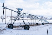 Center pivot irrigates field with water from the Gallatin River watershed. Bozeman, MT. March, 2020. Bozeman, Gallatin County, Montana. Original public domain image from Flickr