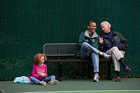 President Barack Obama, Vice President Joe Biden and Claire Duncan, daughter of Education Secretary Arne Duncan, watch a tennis match at Camp David, Md., Oct. 3, 2010.