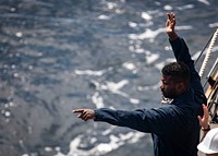 ATLANTIC OCEAN (March 12, 2021) Chief Boatswain&rsquo;s Mate Brian Nichols points to a simulated man overboard during a man overboard drill aboard the Arleigh Burke-class guided-missile destroyer USS Porter (DDG 78) during exercise Atlas Handshake with the Royal Moroccan Navy multipurpose frigate RMN Muhammed VI (F 701), March 12, 2021.
