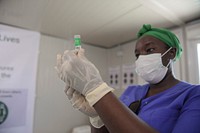 A medical officer serving under the African Union Mission in Somalia (AMISOM) prepares to administer the COVID-19 vaccine at the launch of the COVID-19 vaccination campaign in Mogadishu, Somalia on 17 May 2021.