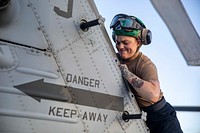 BRITISH ISLES (May 17, 2021) Aviation Electrician’s Mate 3rd Class Tylee Allen, from Portsmouth, Ohio, conducts maintenance on an MH-60R Sea Hawk assigned to the “Spartans” of Helicopter Maritime Strike (HSM) Squadron 70 aboard the Arleigh Burke-class guided-missile destroyer USS Paul Ignatius (DDG 117) during exercise At-Sea Demo/Formidable Shield, May 17, 2021.