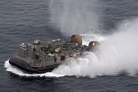 ATLANTIC OCEAN (May 17, 2021) A landing craft, air cushion, attached to Assault Craft Unit (ACU) 4, transits alongside the Wasp-class amphibious assault ship USS Iwo Jima (LHD 7) during a photo exercise, May 17, 2021.