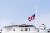 The U.S. flag flies at half-staff above the White House Tuesday, March 23, 2021, in memory of the victims of Monday’s mass shooting in Boulder, Colorado. (Official White House Photo by Cameron Smith). Original public domain image from Flickr