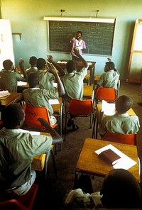 A Peace Corps Volunteer teaches an English class at Kisumu Technical School in Kenya,1979. Original public domain image from Flickr