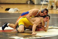 U.S. Coast Guard Academy First Class Cadet Andrew Snyder, a native of Tamaqua, Penn., wrestles against a Trinity College student at the Coast Guard Academy in New London, Conn., Feb. 10, 2011. Snyder's 6-0 win against Trinity College marks his 30th win of the season. U.S. Coast Guard photograph by Petty Officer 3rd Class Diana Honings. Original public domain image from Flickr