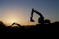 Bulldozer/excavator at sunset, construction vechicle. Original public domain image from Flickr