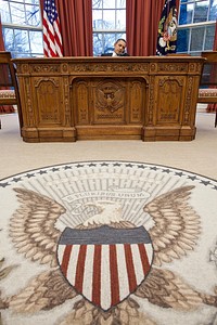 President Barack Obama talks on the phone with British Prime Minister David Cameron in the Oval Office, Feb. 24, 2011.