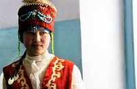 A local woman in her traditional attire and headpiece,. Original public domain image from Flickr