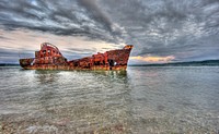 Abandoned rusty ship in Papua New Guinea. Original public domain image from Flickr