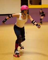 Petty Officer 3rd Class Destinee Winslow skates Sunday, May 1, 2011, during a roller derby practice in Groton, Conn. Winslow uses roller derby as one of many types of physical activities she participates in. U.S. Coast Guard photograph by Petty Officer 3rd Class Diana Honings. Original public domain image from Flickr