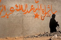 U.S. Army Spc. Mark Santos, a rifleman assigned to Zabul Provincial Reconstruction Team, patrols in Qalat, Zabul province, Afghanistan, Sept. 25, 2011. (DoD photo by Senior Airman Grovert Fuentes-Contreras, U.S. Air Force/Released). Original public domain image from Flickr