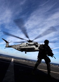 USNS ARCTIC - A Marine with the 24th Marine Expeditionary Unit's Force Reconnaissance Platoon, provide security while a CH-53E Super Stallion lands on the USNS Arctic during a simulated Expanded, Visit, Board, Search and Seizure, Dec. 7, 2011 The 24th MEU is currently taking part in Composite Training Unit Exercise (COMPTUEX), scheduled to take place Nov. 28 to Dec. 21. The training is meant to develop cohesion between the 24th MEU and Amphibious Squadron 8 (PHIBRON 8) in conducting amphibious operations, crisis response, and limited contingency operations while operating from the sea.