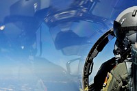 U.S. Air Force Maj. Joe Elam, with the 4th Operations Support Squadron, scans the surrounding airspace aboard an F-15E Strike Eagle aircraft during a Turkey Shoot training mission near Seymour Johnson Air Force Base, N.C., April 16, 2012.