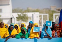 Somali women stand at Mogadishu International Airport during a ceremony held 25 March to recieve the casket containing the body of fomer Somali president Abdullahi Yusuf Ahmed who died aged 77 at a hospital in the Gulf State of Abu Dhabi 23 March.