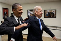 President Barack Obama jokes with Vice President Joe Biden backstage before the STOCK Act signing event in the Eisenhower Executive Office Building South Court Auditorium, April 4, 2012.