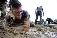 A first-year midshipman, or plebe, is splashed with mud while participating in Sea Trials May 15, 2012, at the U.S. Naval Academy in Annapolis, Md. Sea Trials, modeled after the Marine Corps’ Crucible and the Navy’s Battle Stations recruit programs, is an annual capstone event for fourth class midshipmen and serves as a leadership challenge for upper class midshipmen, who lead each activity during the exercise.