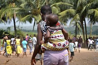 Ghana mother and child visit water pump provided by USAID. (USAID/Kasia McCormick) 2012. Original public domain image from Flickr