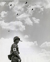 09-8046-035 Combat Corpsmen - Hospitalman James R. Bergmann, U.S. Navy of Washington, D.C. awaits helicopters which will evacuate simulated casualties during a demonstration at the Marine Corps Schools, Quantico, Virginia.