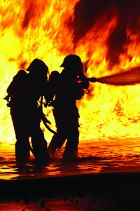 U.S. Marine aircraft rescue and firefighting units assigned to Marine Corps Air Station Yuma and Marine Corps Air Station Miramar extinguish a jet fuel fire at Marine Corps Air Station Miramar, Calif., July 27, 2012.