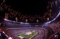 U.S. Marines, Sailors, Coast Guardsmen, Airmen and Soldiers unfurl an American flag across the field at MetLife Stadium, East Rutherford, N.J., Sept. 5, 2012, during a pre-game ceremony before the New York Giants versus Dallas Cowboys football game.