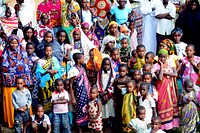 Patients watch a local radio station disc jockey on stage in Tswaka, Kenya, Aug. 26, 2012, during a medical civic action project (MEDCAP).