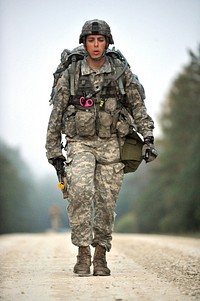 A U.S. Army medic perform a road march