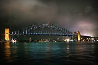 Sydney Harbour Bridge.The Sydney Harbour Bridge is a steel through arch bridge across Sydney Harbour that carries rail, vehicular, bicycle, and pedestrian traffic between the Sydney central business district and the North Shore. Original public domain image from Flickr