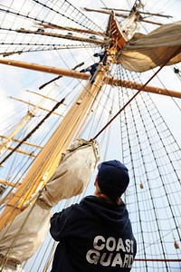 Officer Candidates Aboard Barque EagleATLANTIC OCEAN - U.S. Coast Guard Barque Eagle crewmember Seaman Karen Hesson watches as Coast Guard Academy officer candidates unfurl sails on America's Tall Ship Sept. 15, 2012. Officer candidates spend two weeks aboard the Eagle during their 17-week school to further develop their seamanship, teamwork and leadership skills. (U.S. Coast Guard photo by Petty Officer 1st Class Lauren Jorgensen). Original public domain image from Flickr