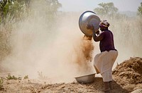 Cleaning soya. A woman cleans soya in Bincheratanga, Northern Region. (USAID/A. Kauffeld). Original public domain image from Flickr