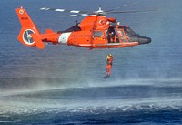 U.S. Coast Guard Petty Officer 1st Class Ty Aweau, an Aviation Survival Technician, conducts rescue swimmer training with an aircrew in an HH-65 Dolphin helicopter off Hermosa Beach, Calif., Nov. 16, 2012.