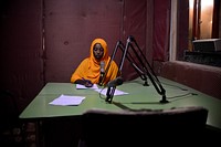 A presenter at Radio Shabelle reads the news. With a population that is still one of the world's poorest, radio continues to be one of the primary sources of information for many in Somalia. AU-UN IST PHOTO / TOBIN JONES. Original public domain image from Flickr