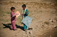 Children play with kites given to them by Afghan Local Police officers in a village in Farah province, Afghanistan, Dec. 9, 2012. (DoD photo by Sgt. Pete Thibodeau, U.S. Marine Corps/Released). Original public domain image from Flickr