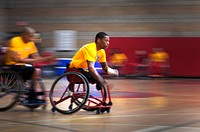 U.S. Marine veteran Cpl. Anthony McDaniel, right, from Pascagoula, Miss., moves ahead of Marine veteran Cpl. Josue Barron, left, from Los Angeles, during wheelchair basketball practice at the 2013 Marine Corps Trials at Camp Pendleton, Calif., Feb. 26, 2013.