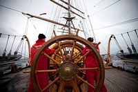 ATLANTIC OCEAN -- Coast Guard Cutter Eagle crewmembers and officer candidates stand helm watch through the storm March 12, 2013. The officer candidates spent two weeks aboard the Eagle during their 17-week course to further develop their seamanship, teamwork and leadership skills. U.S. Coast Guard photo by Petty Officer 3rd Class Cory J. Mendenhall. Original public domain image from Flickr