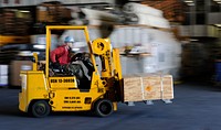 U.S. Navy Aviation Ordnanceman 3rd Class Will Moseley drives a forklift during weapons staging in a hangar bay aboard the aircraft carrier USS John C. Stennis (CVN 74) in the Pacific Ocean April 17, 2013.