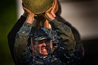 U.S. Naval Academy midshipmen with the Class of 2016 conduct a log carrying exercise as part of the U.S. Naval Academy Sea Trials in Annapolis, Md., May 14, 2013.