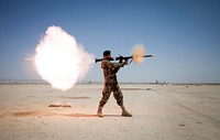 An Afghan National Army (ANA) soldier assigned to the Mobile Strike Force Kandak fires a RPG-7 rocket-propelled grenade launcher during a live-fire exercise supervised by the Marines with the Mobile Strike Force Advisor Team on Camp Shorabak, Helmand province, Afghanistan, May 20, 2013