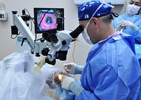 U.S. Air Force Maj. Matthew Caldwell, foreground right, a cornea and refractive surgeon with the 59th Medical Wing, performs cataract surgery June 5, 2013, during New Horizons 2013 at the Southern Regional Hospital in Dangriga, Belize.
