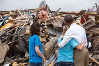 President Barack Obama hugs Amy Simpson, principal of Plaza Towers Elementary School, outside what remains of the school following a tornado in Moore, Okla., May 26, 2013.