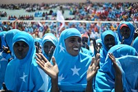 Women adorned in Somali flags celebrate Somalia's Independence Day at Konis stadium in Mogadishu on July 1. Today's celebrations mark 53 years since the Southern regions of Somalia gained independence from Italy and joined with the Northern region of Somaliland to create Somalia.