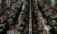 U.S. Army paratroopers with the 3rd Battalion, 319th Field Artillery Regiment, 1st Brigade Combat Team, 82nd Airborne Division wait for takeoff in an Air Force C-17A Globemaster III aircraft June 27, 2013, before an airdrop as part of Joint Operational Access Exercise (JOAX) 13-03 at Pope Field, Fort Bragg, N.C. JOAX is designed to enhance cohesiveness between U.S. Army, Air Force and allied personnel, allowing the services an opportunity to properly execute large-scale heavy equipment and troop movement.