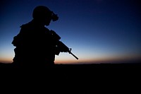 U.S. Navy Hospital Corpsman 3rd Class Ricardo Arrequin, assigned to Georgian Liaison Team-9, provides security in Helmand province, Afghanistan, July 3, 2013, during operation Northern Lion II. Northern Lion II was a Georgian led operation conducted to deter insurgents, establish a presence, and gather human intelligence in the area.