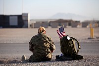 A Danish military hospital corpsman serves as a medical support official during a satellite 10-kilometer race at Camp Leatherneck in Helmand province, Afghanistan, held as part of the Atlanta Journal-Constitution Peachtree Road Race July 4, 2013.