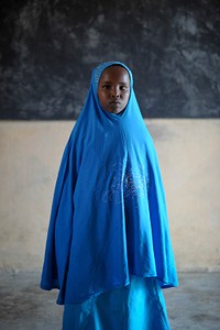 Somali student in blue khimaar.Original public domain image from Flickr