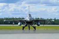 A U.S. Air Force F-16C Fighting Falcon from the New Jersey Air National Guard's 177th Fighter Wing prepares for takeoff at Eielson AFB, AK on July 15, 2011. (U.S. Air National Guard photo by Tech. Sgt. Matt Hecht). Original public domain image from <a href="https://www.flickr.com/photos/matt_hecht/10333801874/" target="_blank" rel="noopener noreferrer nofollow">Flickr</a>