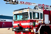 U.S. Air Force fire protection specialists from the New Jersey Air National Guard's 177th Fighter Wing respond to an air mishap exercise at Coast Guard Air Station Atlantic City on Feb. 11, 2014.