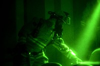 U.S. Air Force firefighters with the 169th Civil Engineer Squadron at McEntire Joint National Guard Base, S.C., conduct a nighttime structural fire exercise at the Joint Armed Forces Reserve Center, Feb. 5, 2014.
